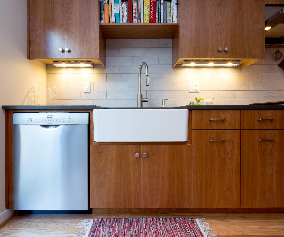 gorgeous kitchen with silver hardware and wood cabinets